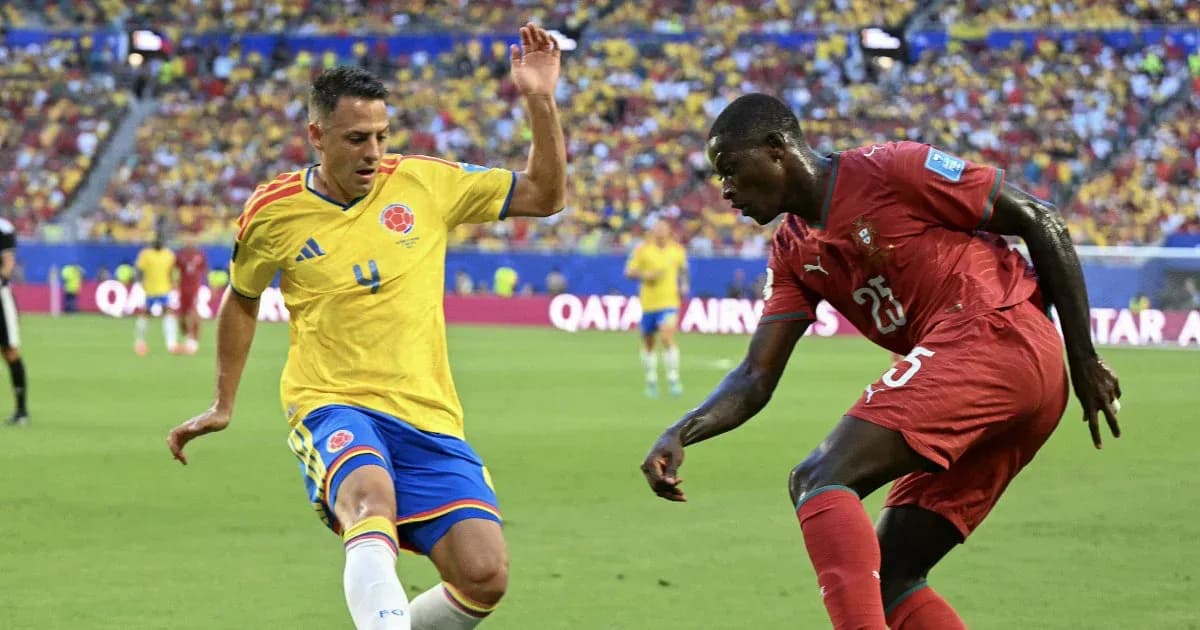 Colombian player challenges Moroccan player for the ball Colombian player challenges Moroccan player for the ball
