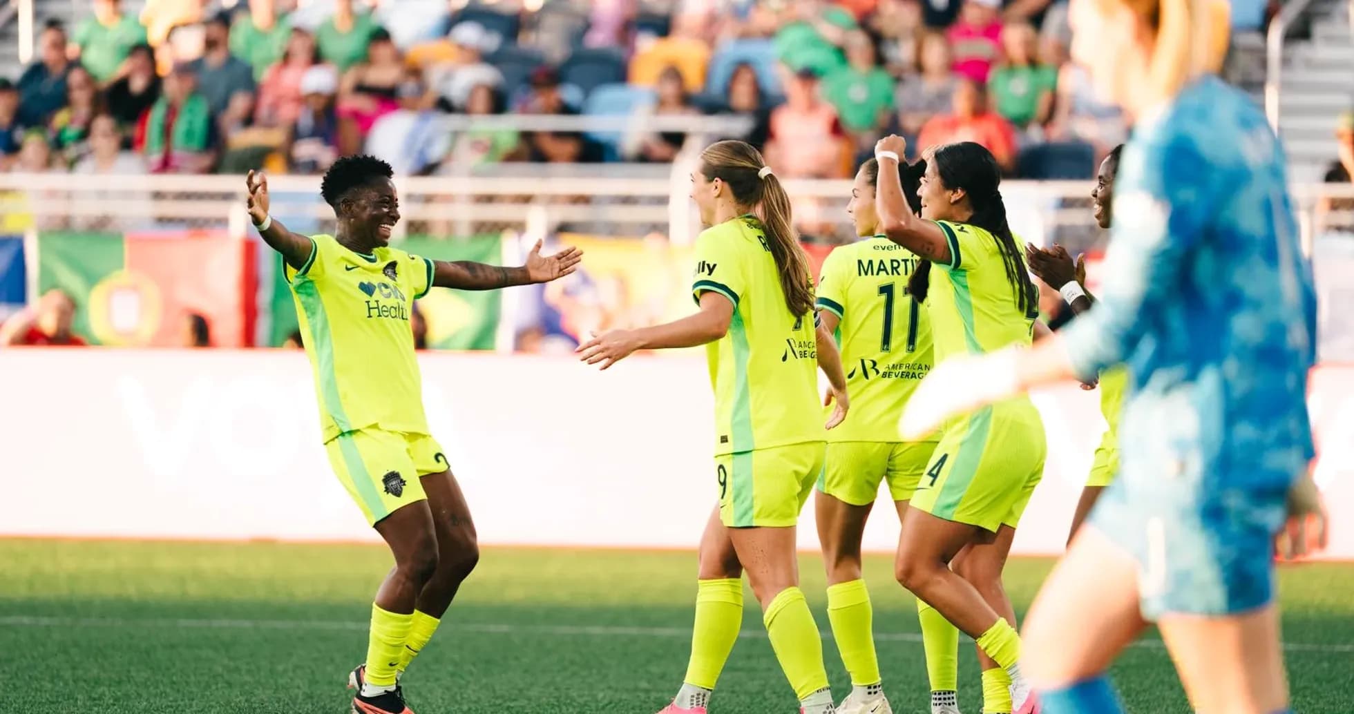 Players celebrating a goal during NWSL match Players celebrating a goal during NWSL match