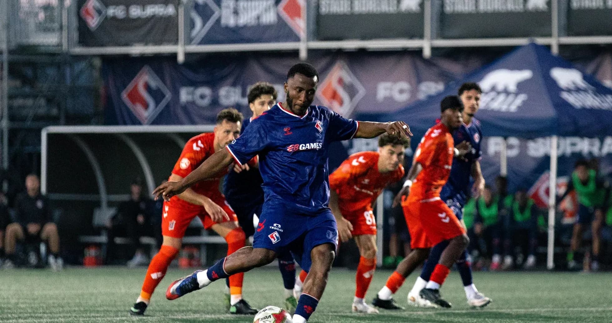 Player kicking ball during FC Supra match Player kicking ball during FC Supra match