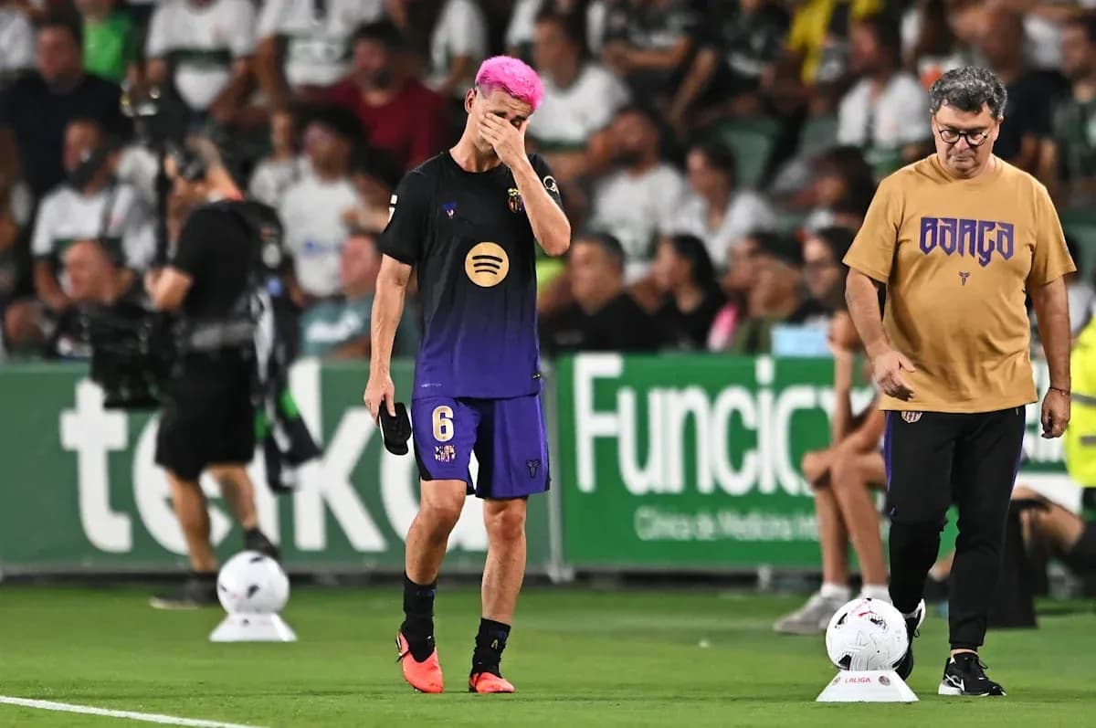 Player with pink hair walking off field, coach observing Player with pink hair walking off field, coach observing