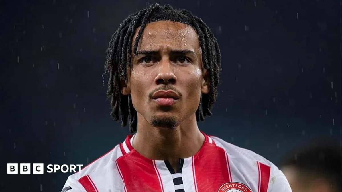 Brentford player looking focused in rainy conditions Brentford player looking focused in rainy conditions