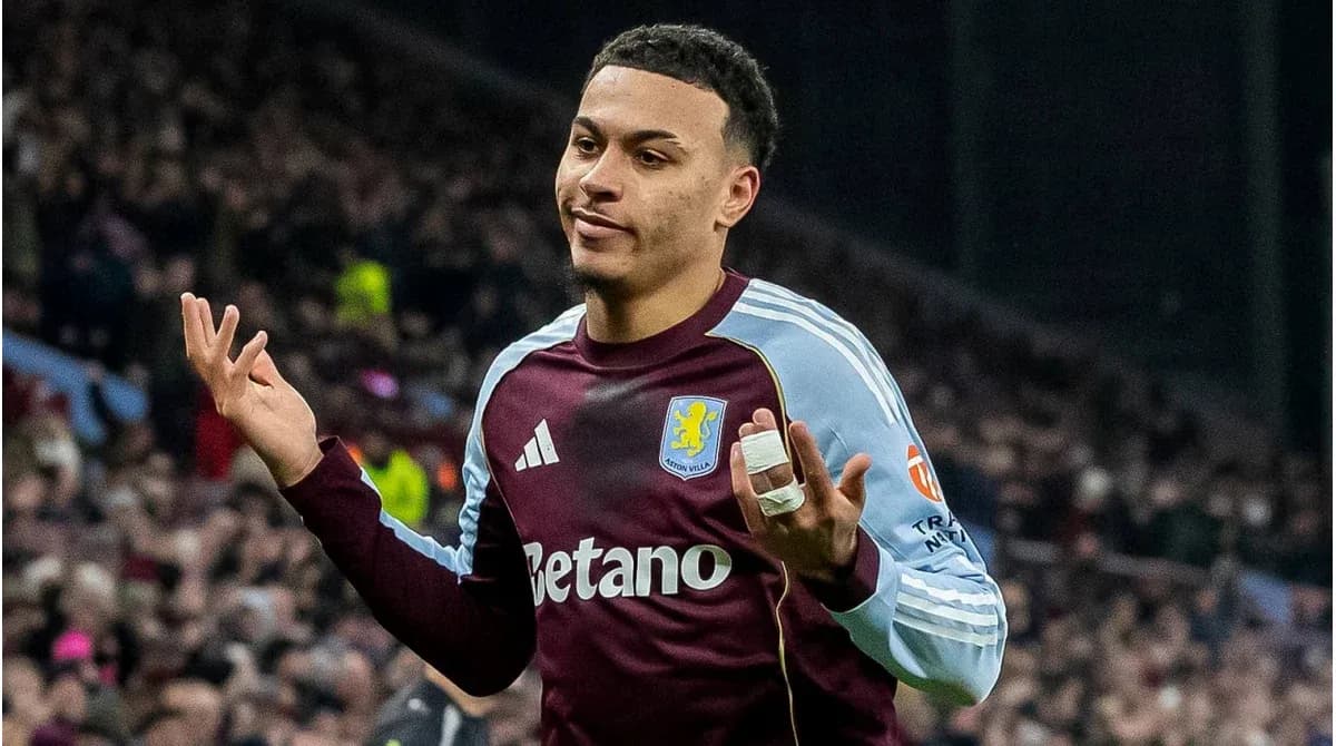 Player gesturing during match, wearing Aston Villa kit Player gesturing during match, wearing Aston Villa kit