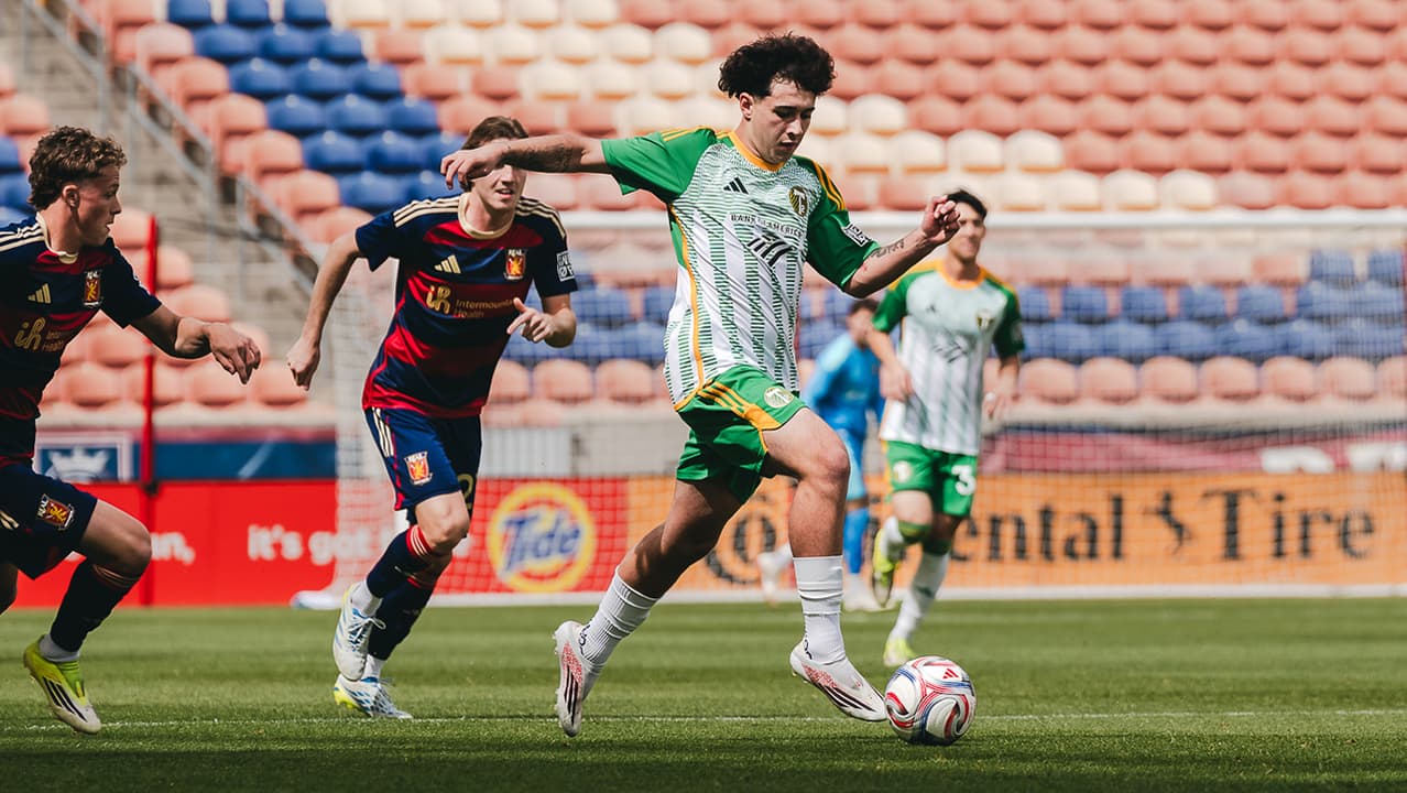 Real Monarchs player dribbling against Portland Timbers II Real Monarchs player dribbling against Portland Timbers II