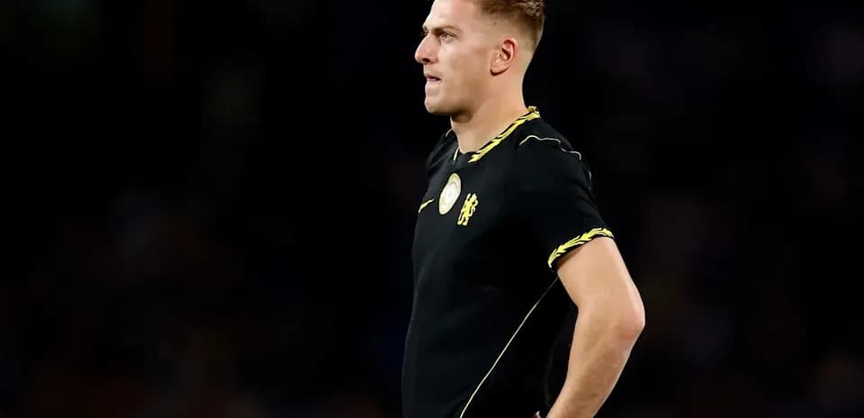 Player in black jersey standing on the field Player in black jersey standing on the field