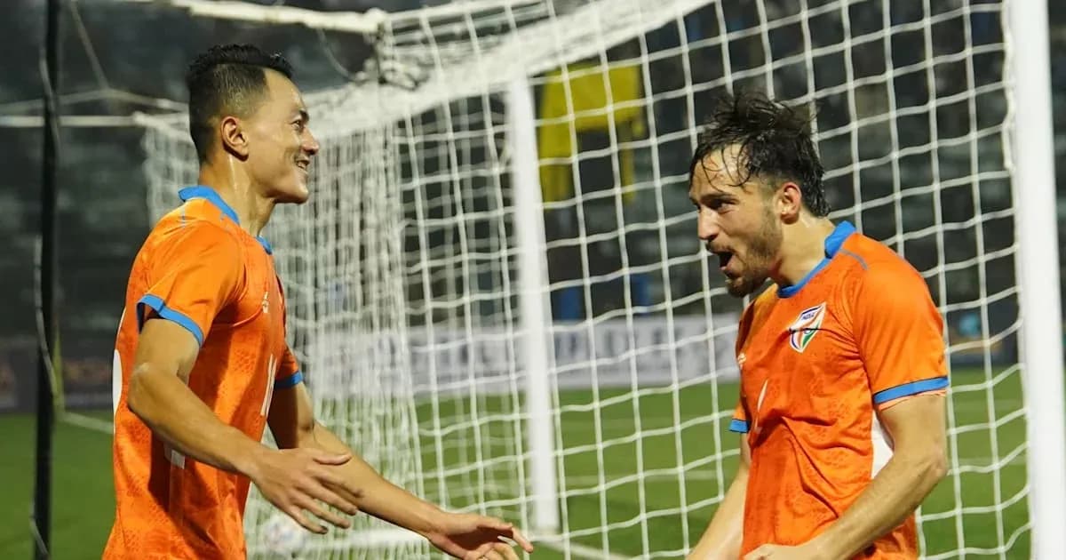 Players celebrating a goal in front of the net Players celebrating a goal in front of the net