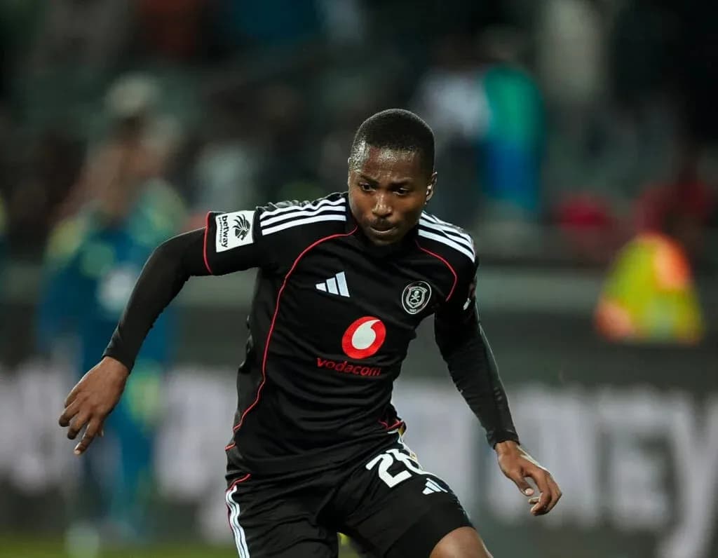 Player sprinting in black kit during match Player sprinting in black kit during match