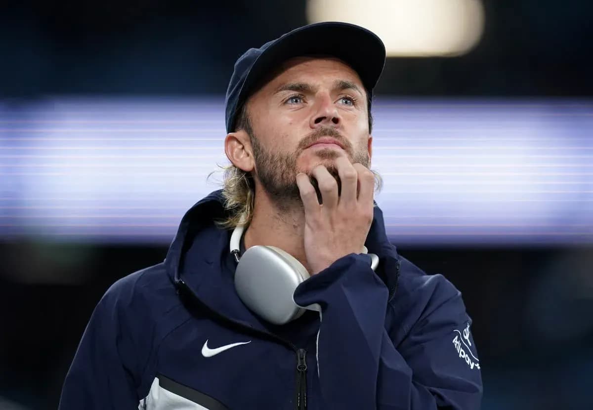 Man wearing headphones, deep in thought Man wearing headphones, deep in thought