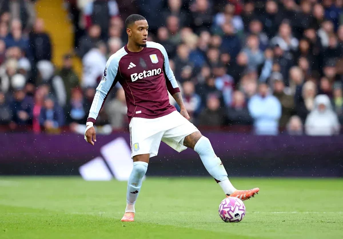 Player from Aston Villa preparing to kick ball Player from Aston Villa preparing to kick ball