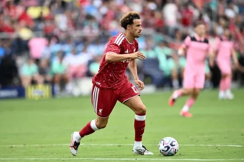 Player dribbling the ball during a match Player dribbling the ball during a match