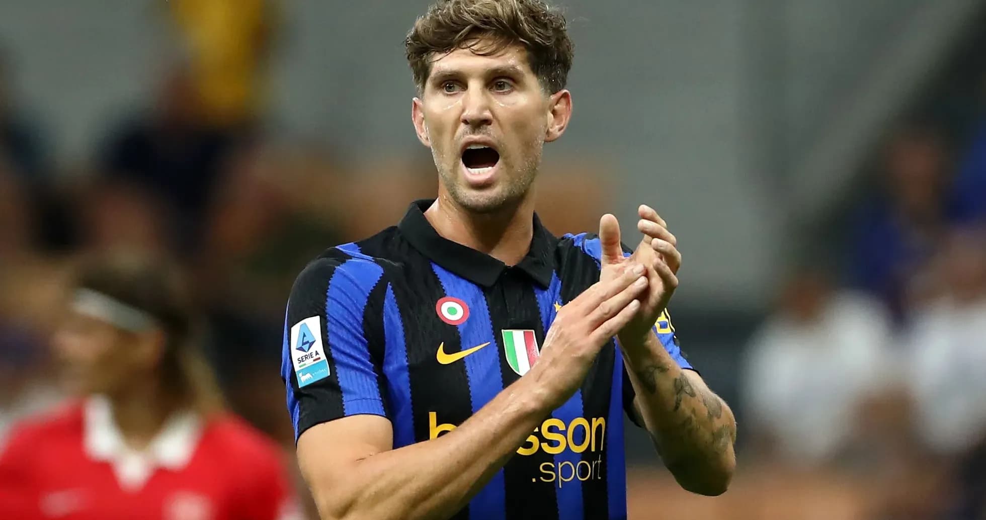 Player gesturing during a football match Player gesturing during a football match