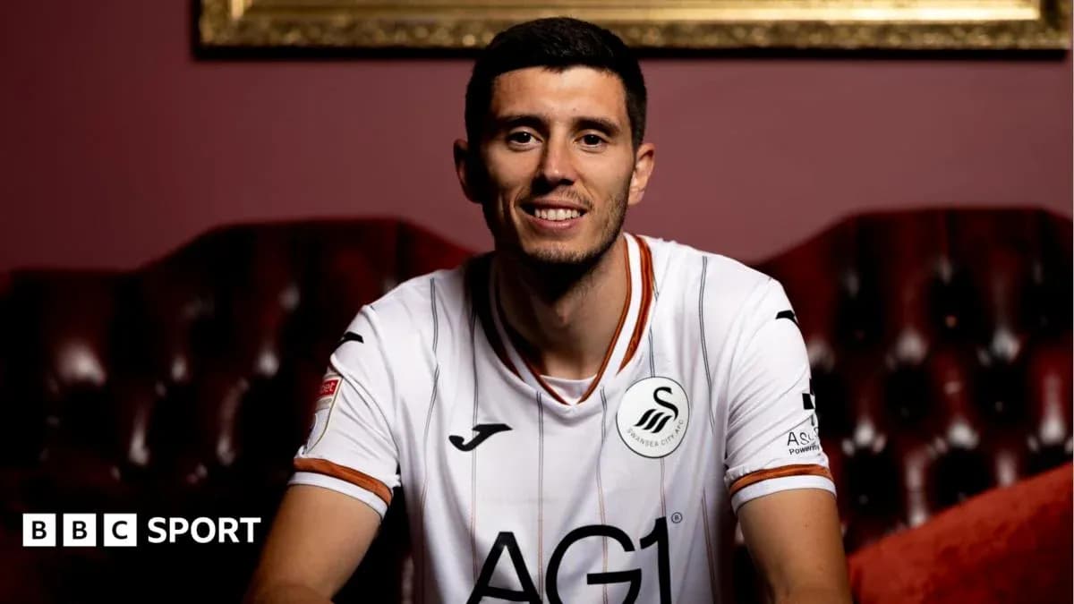 Player in Swansea City jersey smiling for photo Player in Swansea City jersey smiling for photo