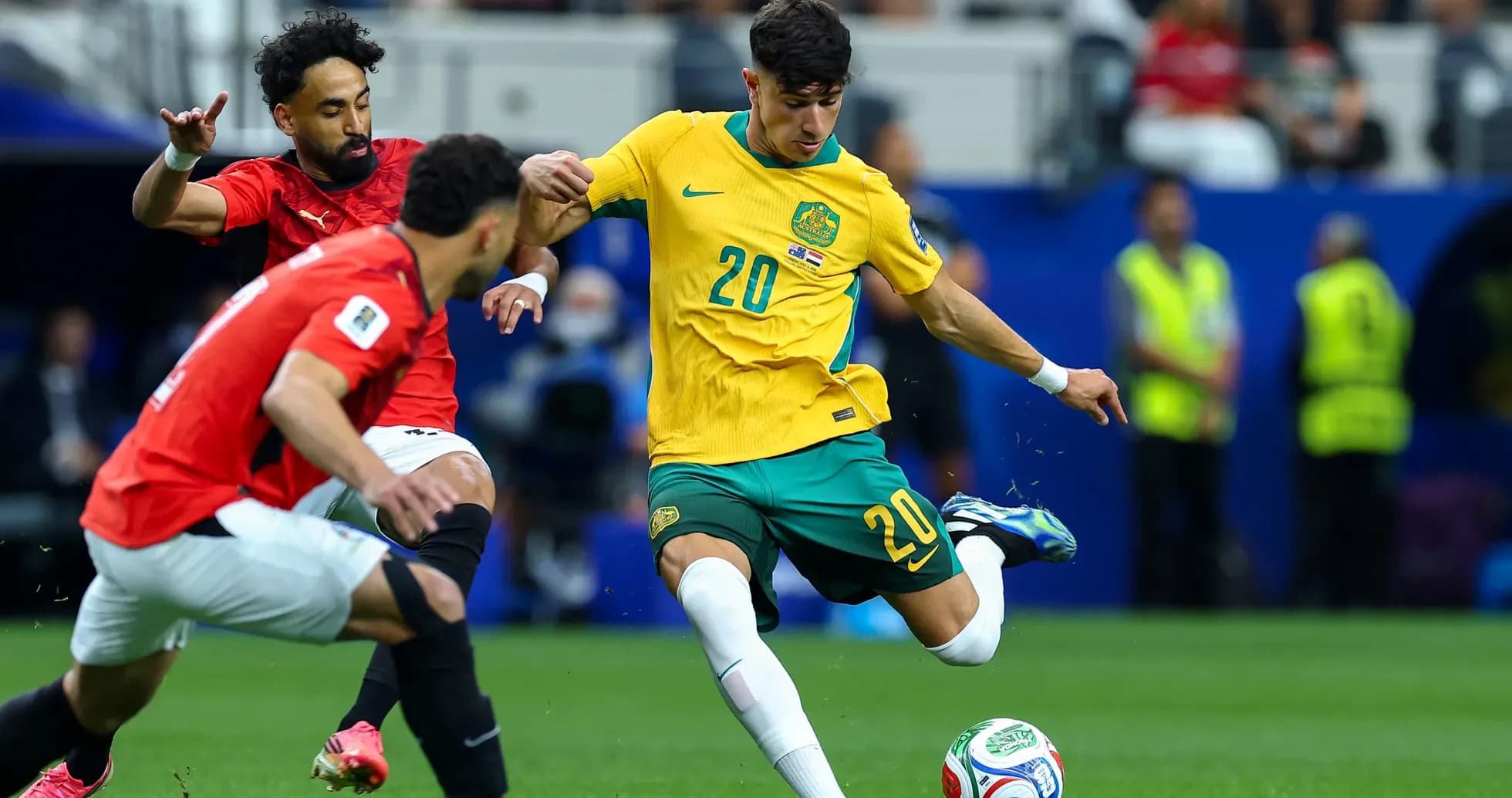 Australia player dribbling past Egyptian defenders Australia player dribbling past Egyptian defenders