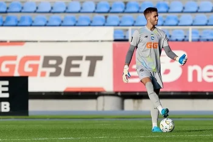 Goalkeeper practicing with ball during training session Goalkeeper practicing with ball during training session