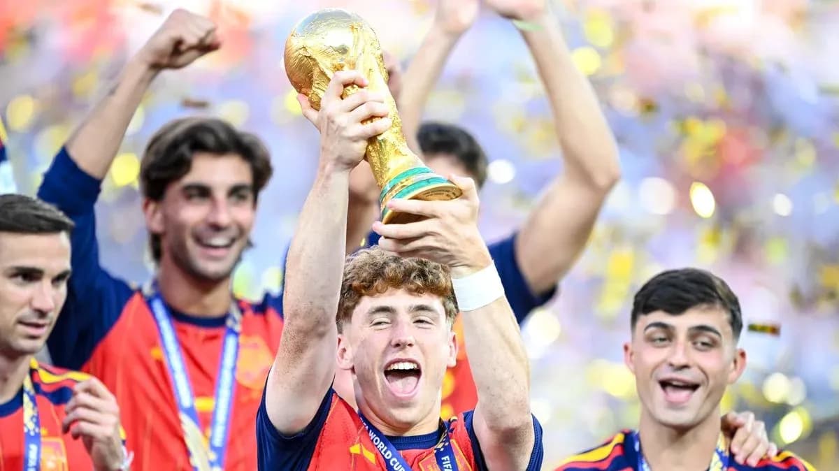 Player celebrating with FIFA World Cup trophy Player celebrating with FIFA World Cup trophy