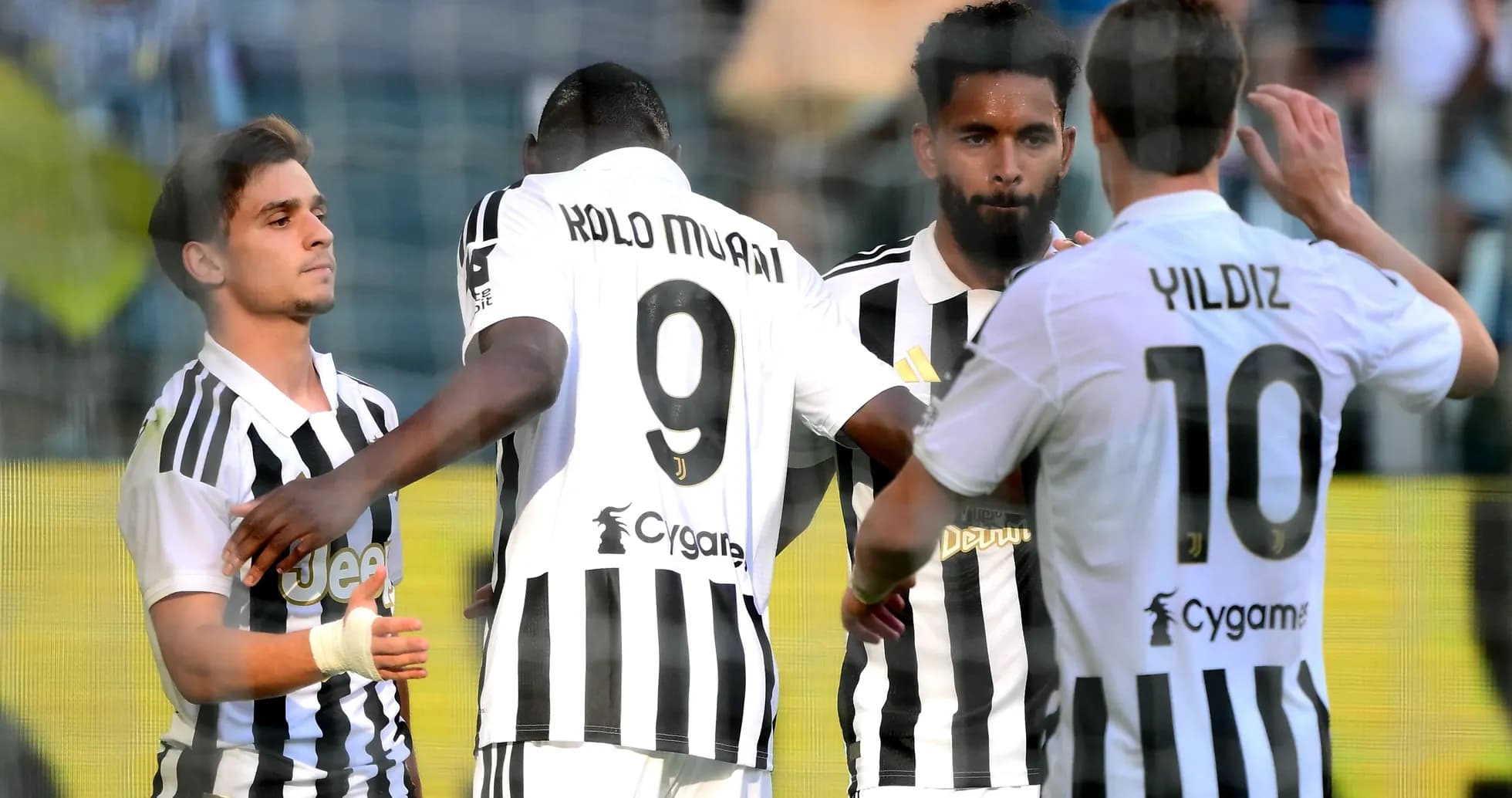 Players celebrating a goal during a match Players celebrating a goal during a match