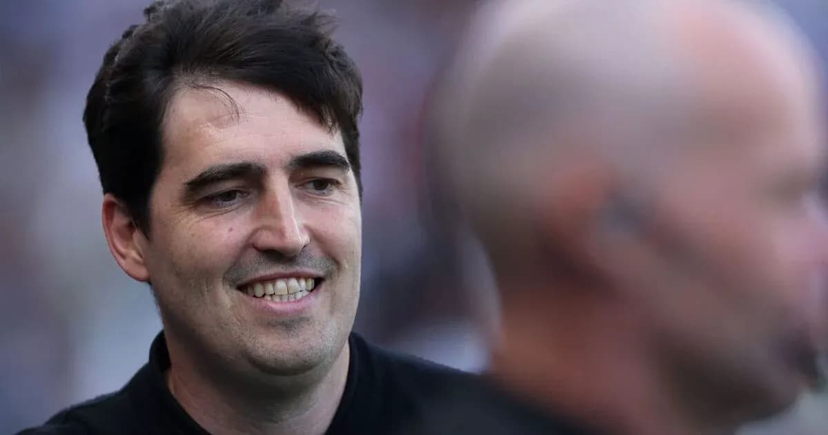 Man smiling during a sporting event interaction Man smiling during a sporting event interaction