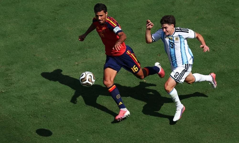 Two players competing for the ball on field Two players competing for the ball on field