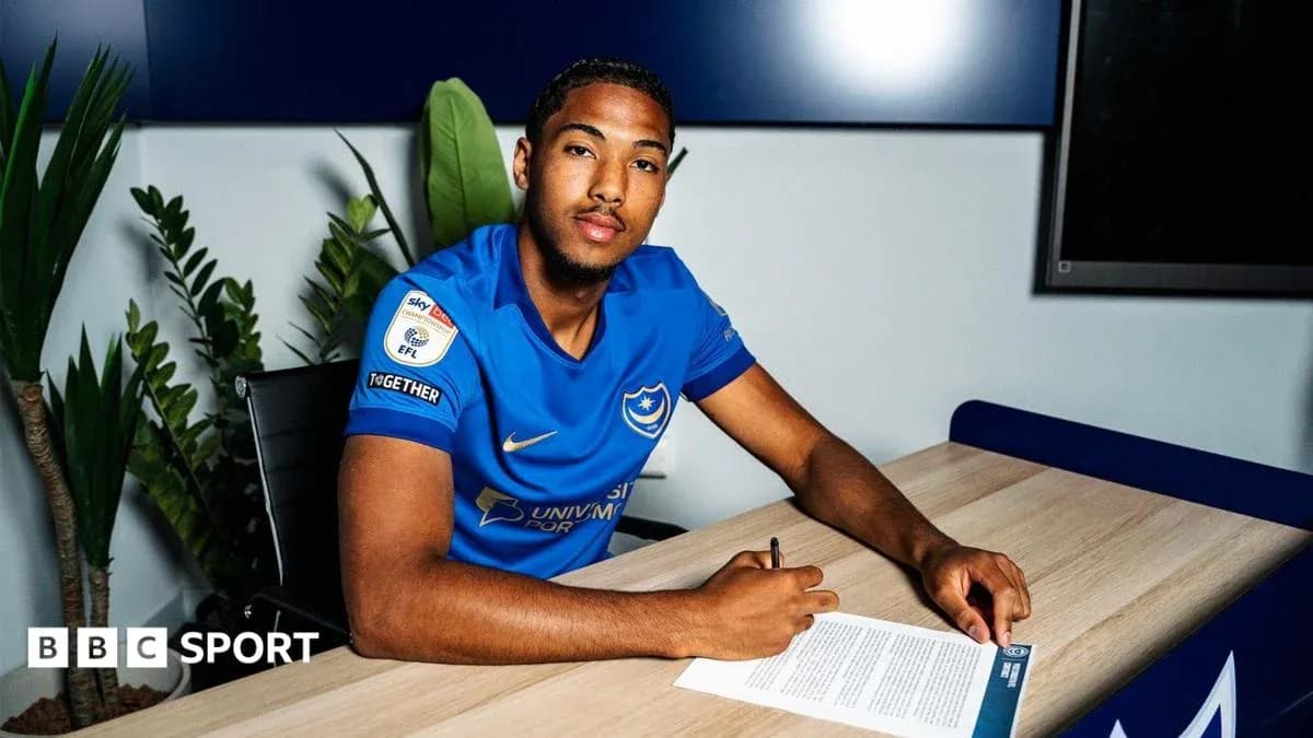 Player signing contract at Portsmouth club office Player signing contract at Portsmouth club office