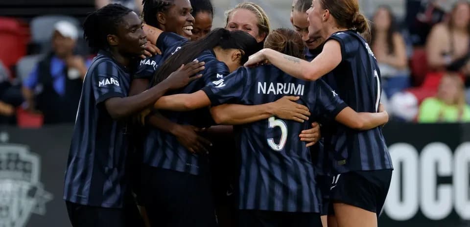 Washington Spirit players celebrating a goal Washington Spirit players celebrating a goal