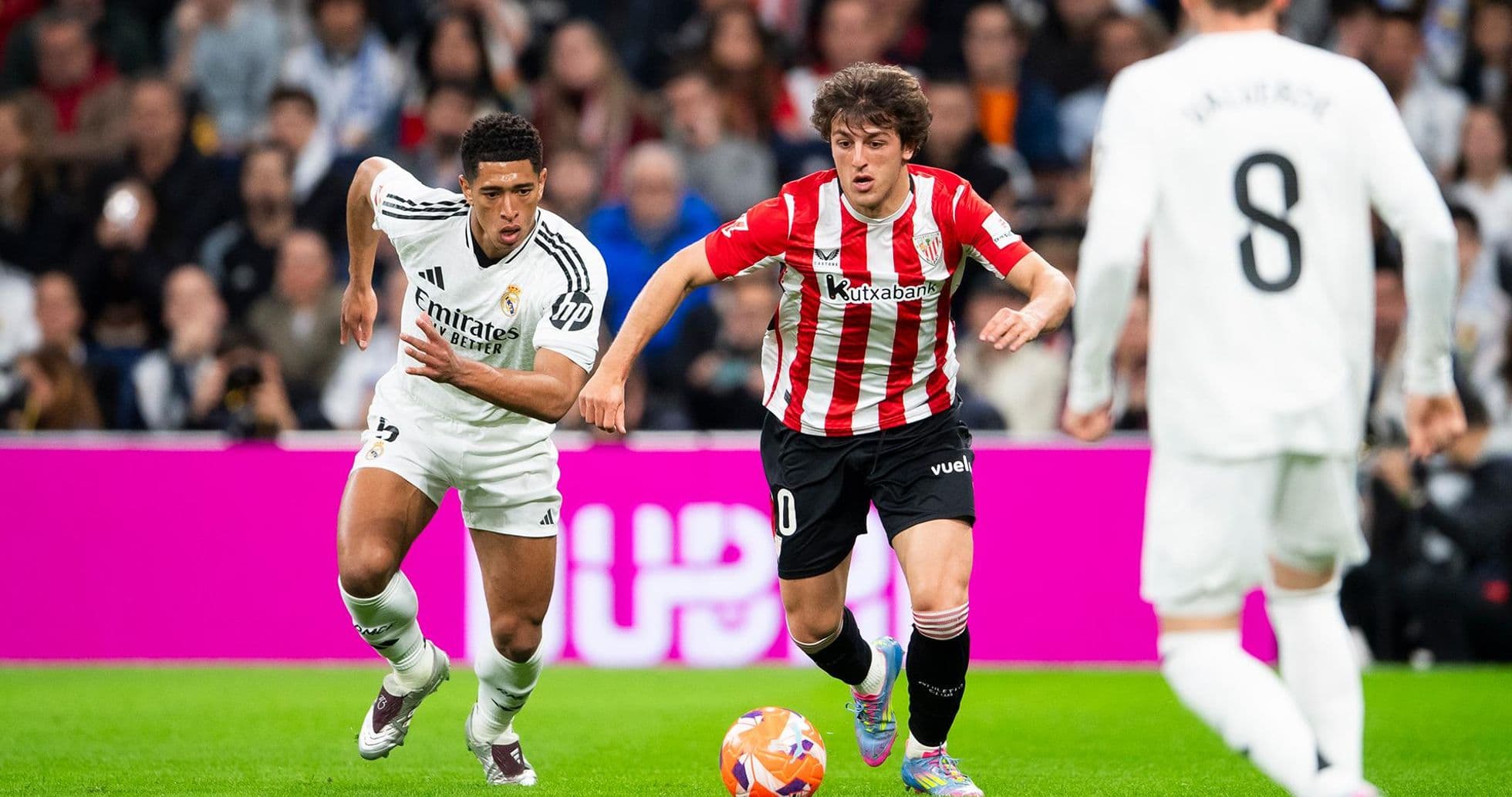 Real Madrid player chasing Athletic Club opponent Real Madrid player chasing Athletic Club opponent