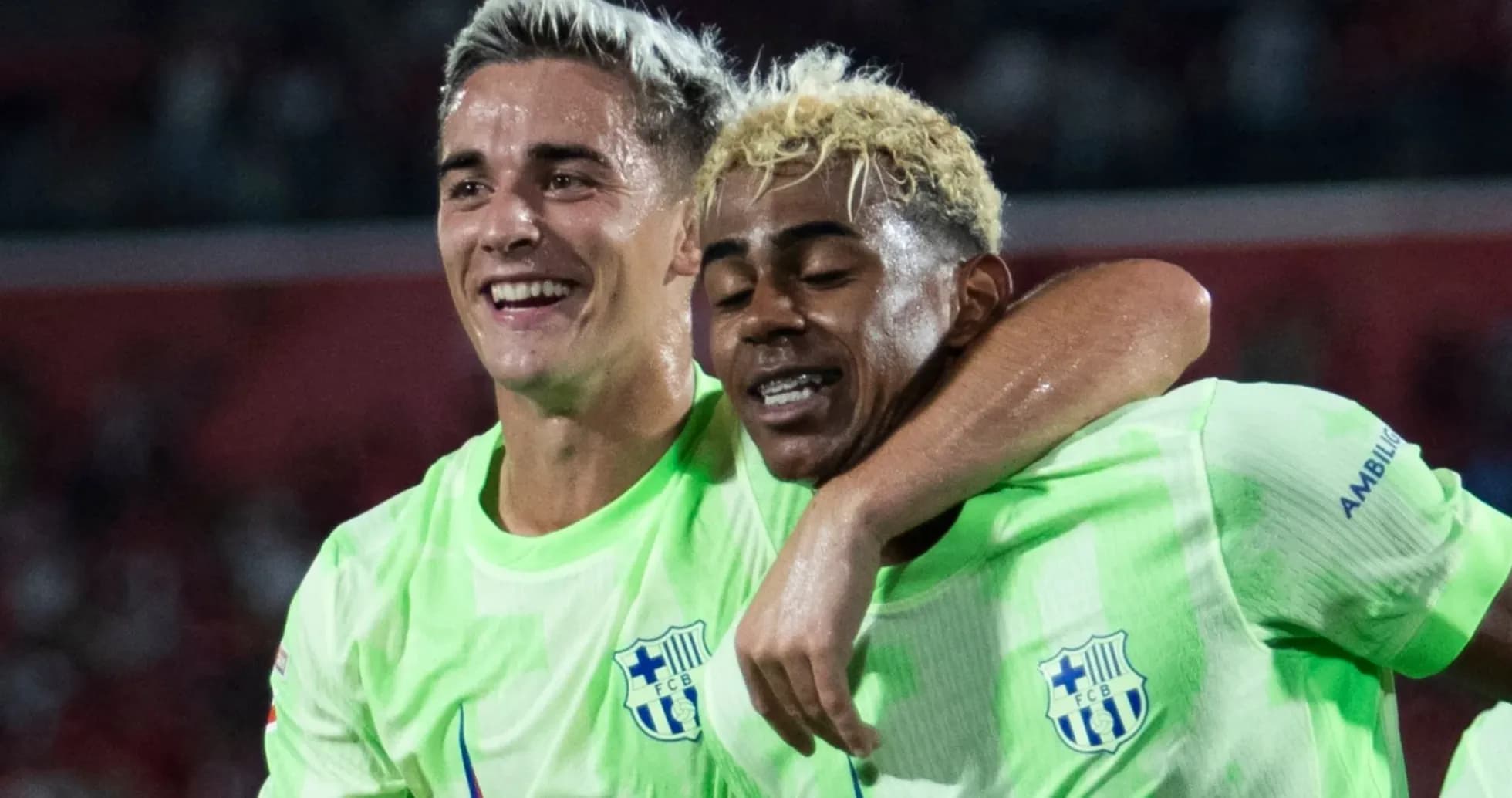 Two players celebrating together after scoring a goal Two players celebrating together after scoring a goal