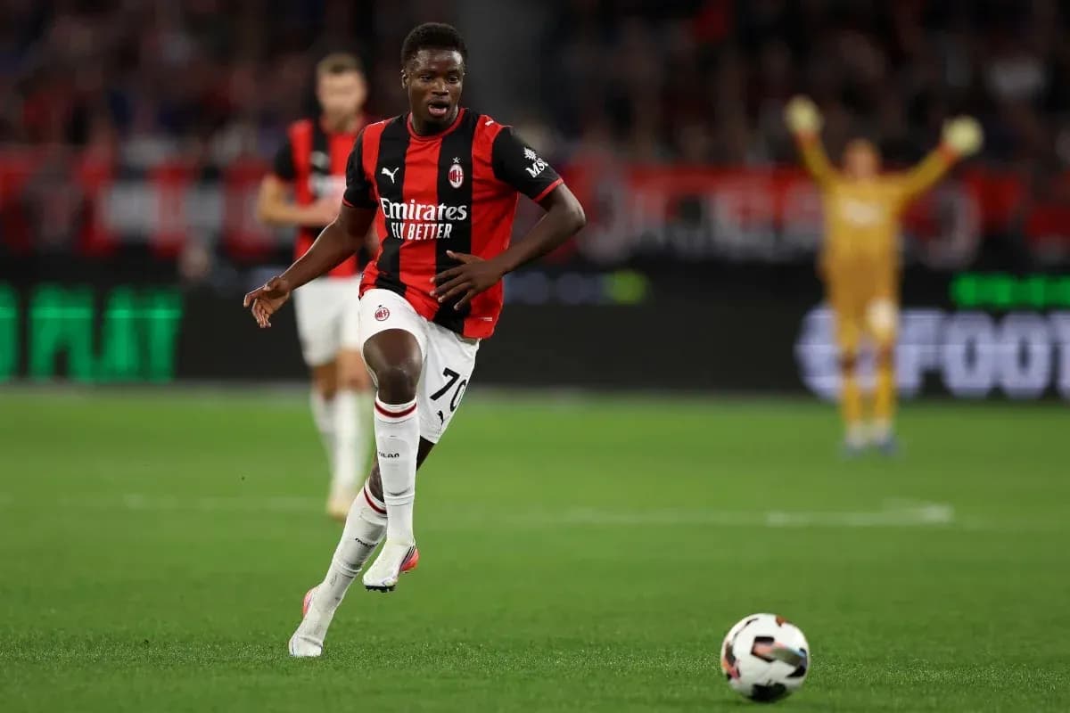AC Milan player dribbling ball during match AC Milan player dribbling ball during match