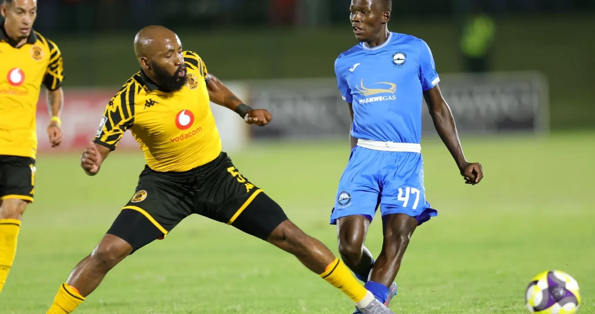 Two players contesting the ball during a match Two players contesting the ball during a match