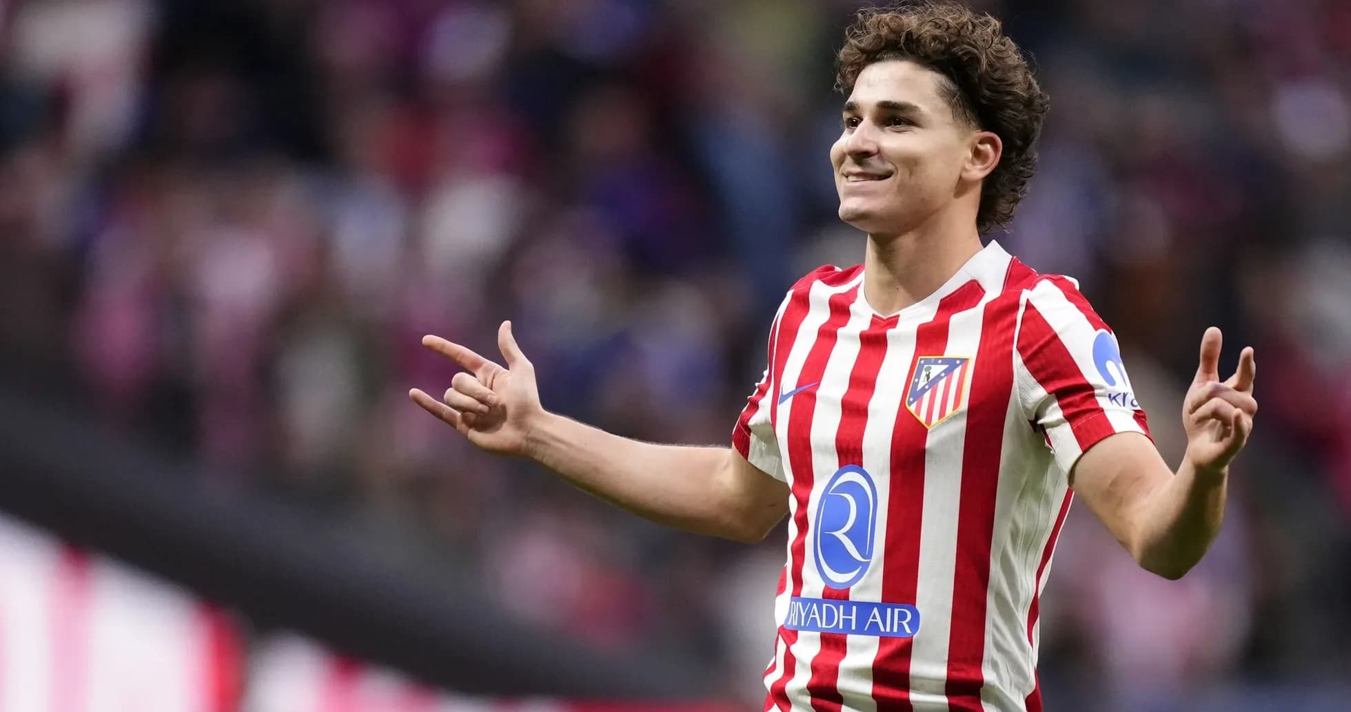 Player celebrating after scoring a goal for Atlético Madrid Player celebrating after scoring a goal for Atlético Madrid