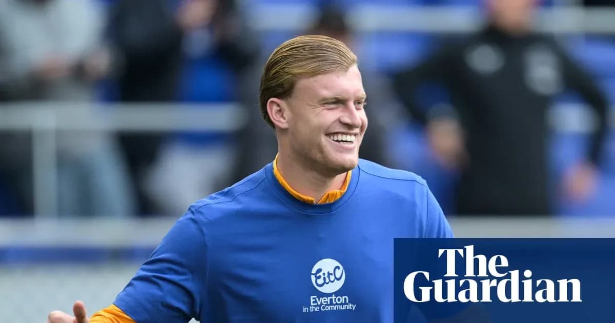 Player smiling during warm-up at Everton training Player smiling during warm-up at Everton training