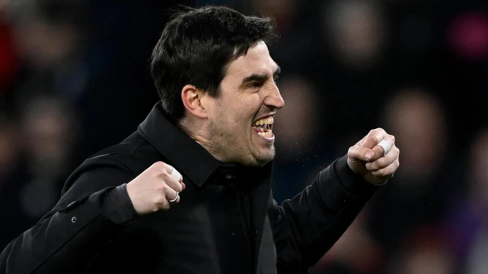 Coach celebrating enthusiastically during a match Coach celebrating enthusiastically during a match