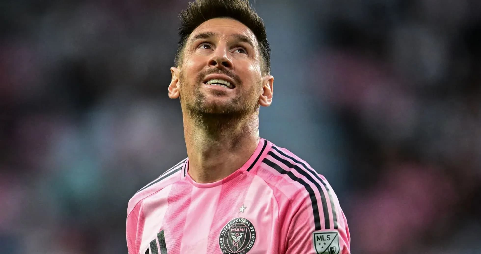 Player looking up while wearing pink jersey Player looking up while wearing pink jersey