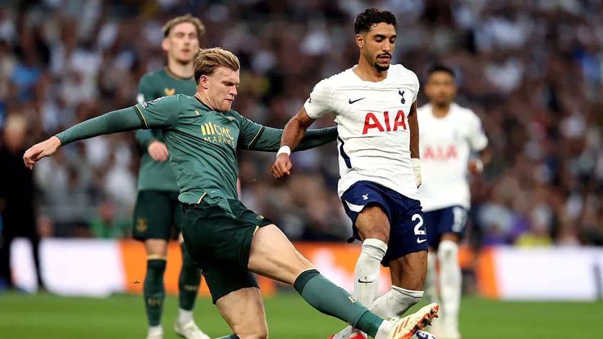 Player tackling opponent during football match action Player tackling opponent during football match action