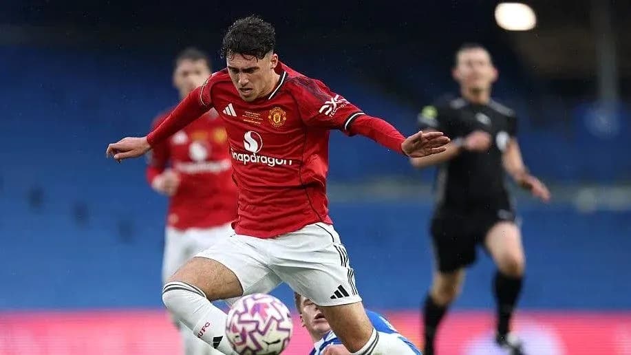 Player in red jersey falling during a match Player in red jersey falling during a match