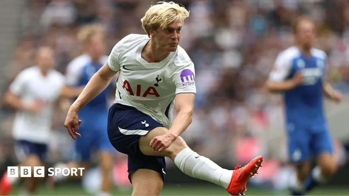 Tottenham player kicking the ball during match Tottenham player kicking the ball during match