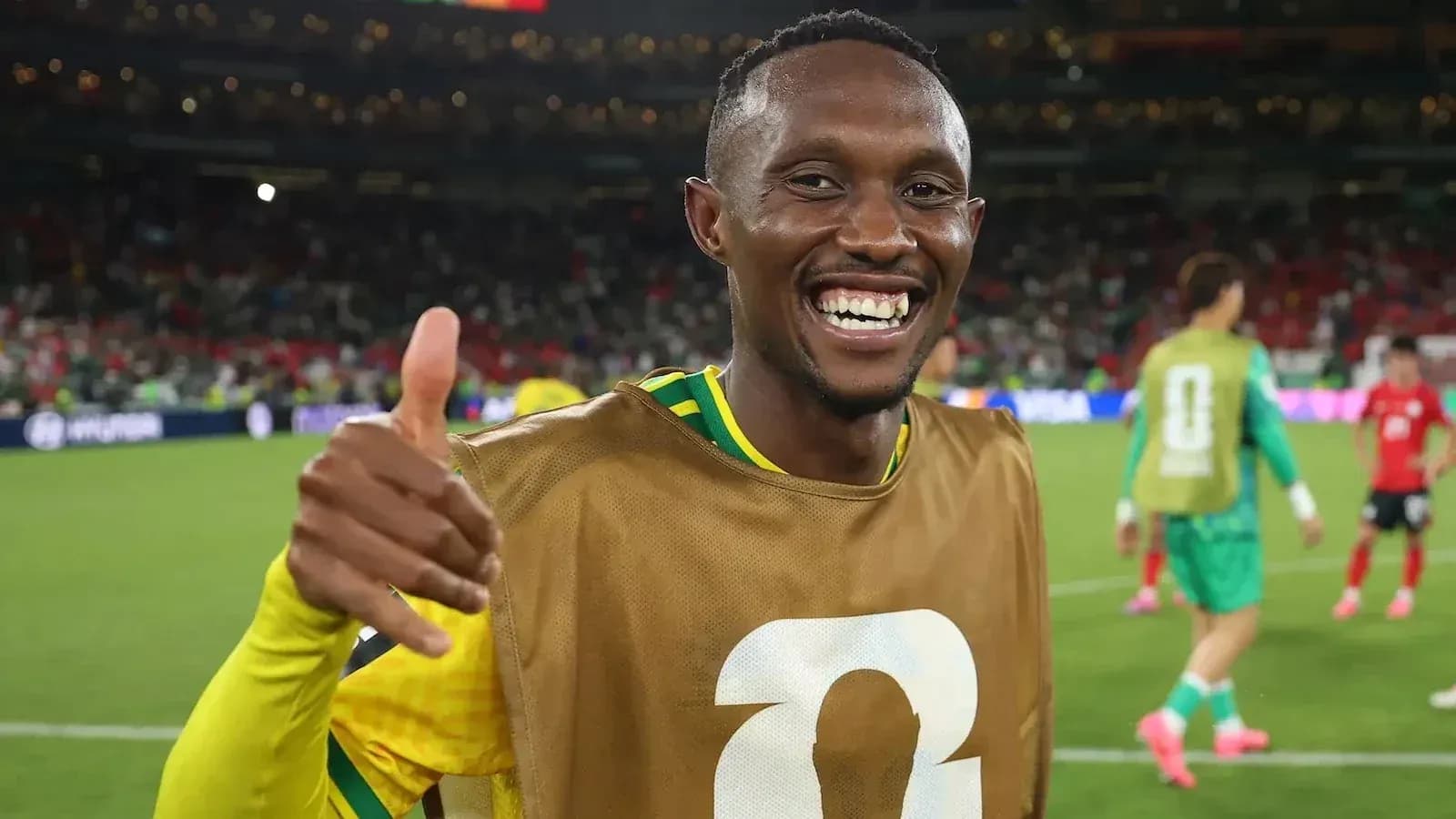 Player celebrating with a thumbs up on the field Player celebrating with a thumbs up on the field