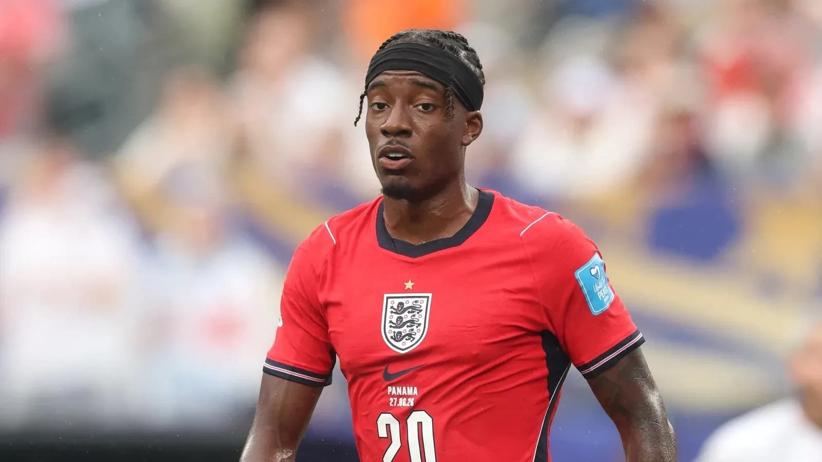 Player in red England kit during match Player in red England kit during match