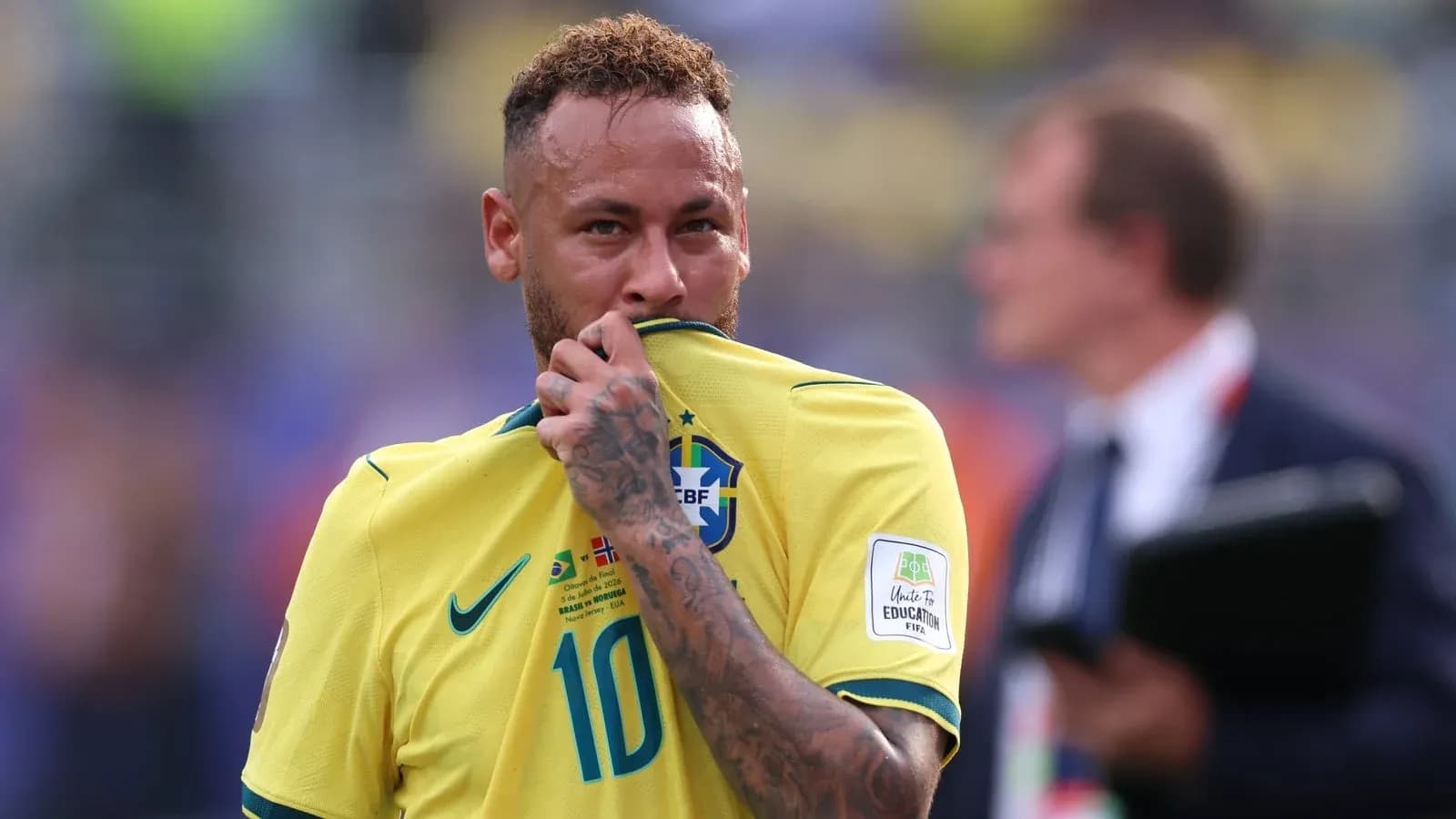 Neymar holding his jersey during a match Neymar holding his jersey during a match