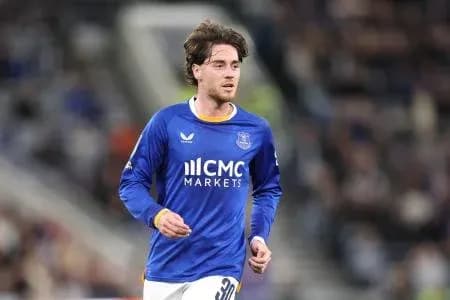 Player running on the pitch in blue jersey Player running on the pitch in blue jersey