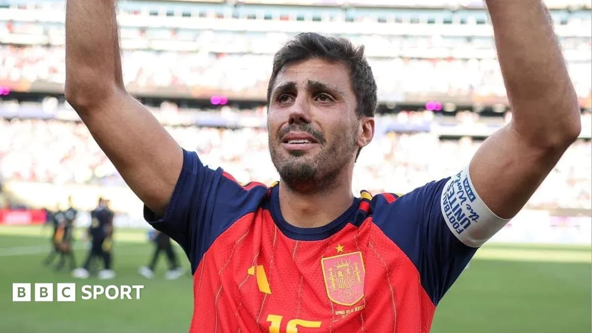 Player celebrating with raised arms in Spain kit Player celebrating with raised arms in Spain kit