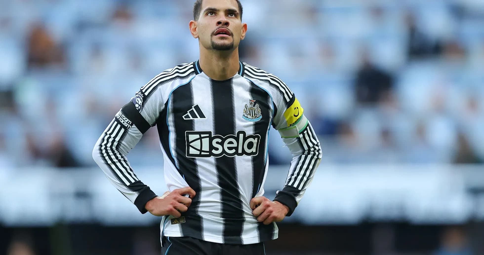 Newcastle player wearing captain's armband on pitch Newcastle player wearing captain's armband on pitch