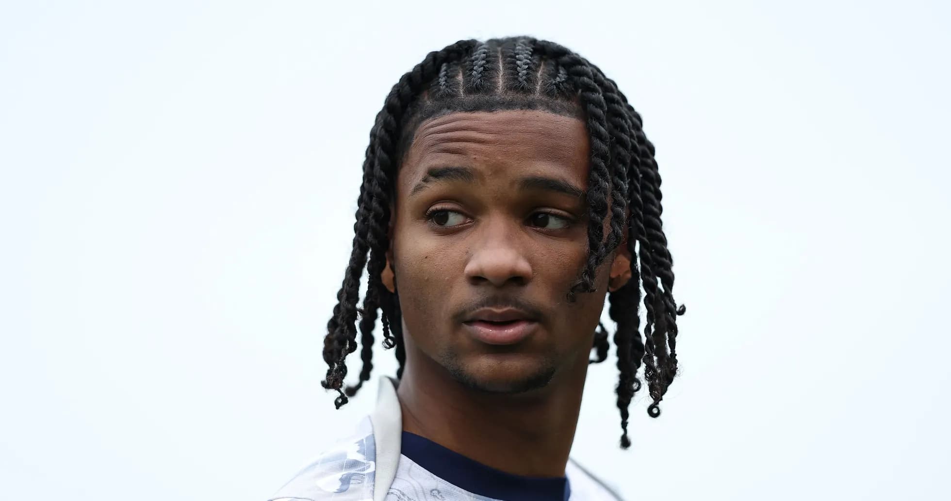 Player with braided hair looking to the side Player with braided hair looking to the side
