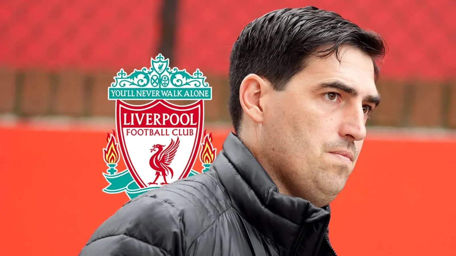 Coach in front of Liverpool FC logo at training ground Coach in front of Liverpool FC logo at training ground