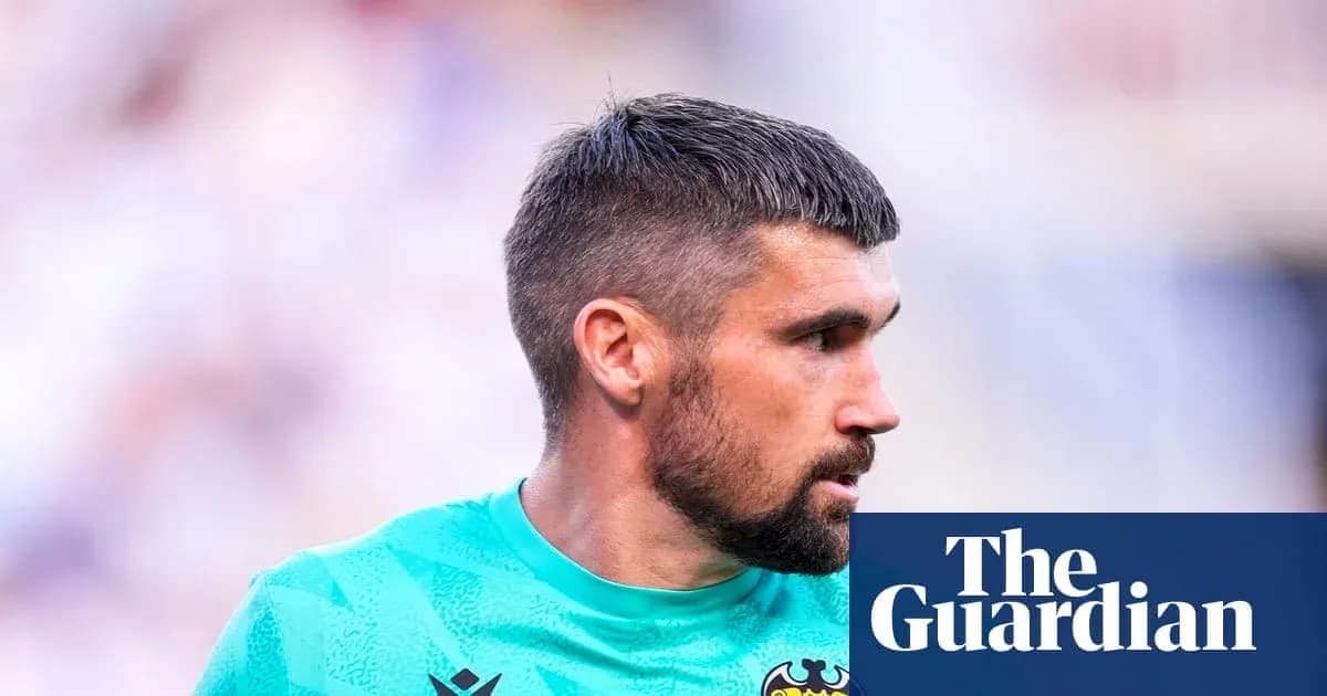 Goalkeeper in a green kit during match Goalkeeper in a green kit during match