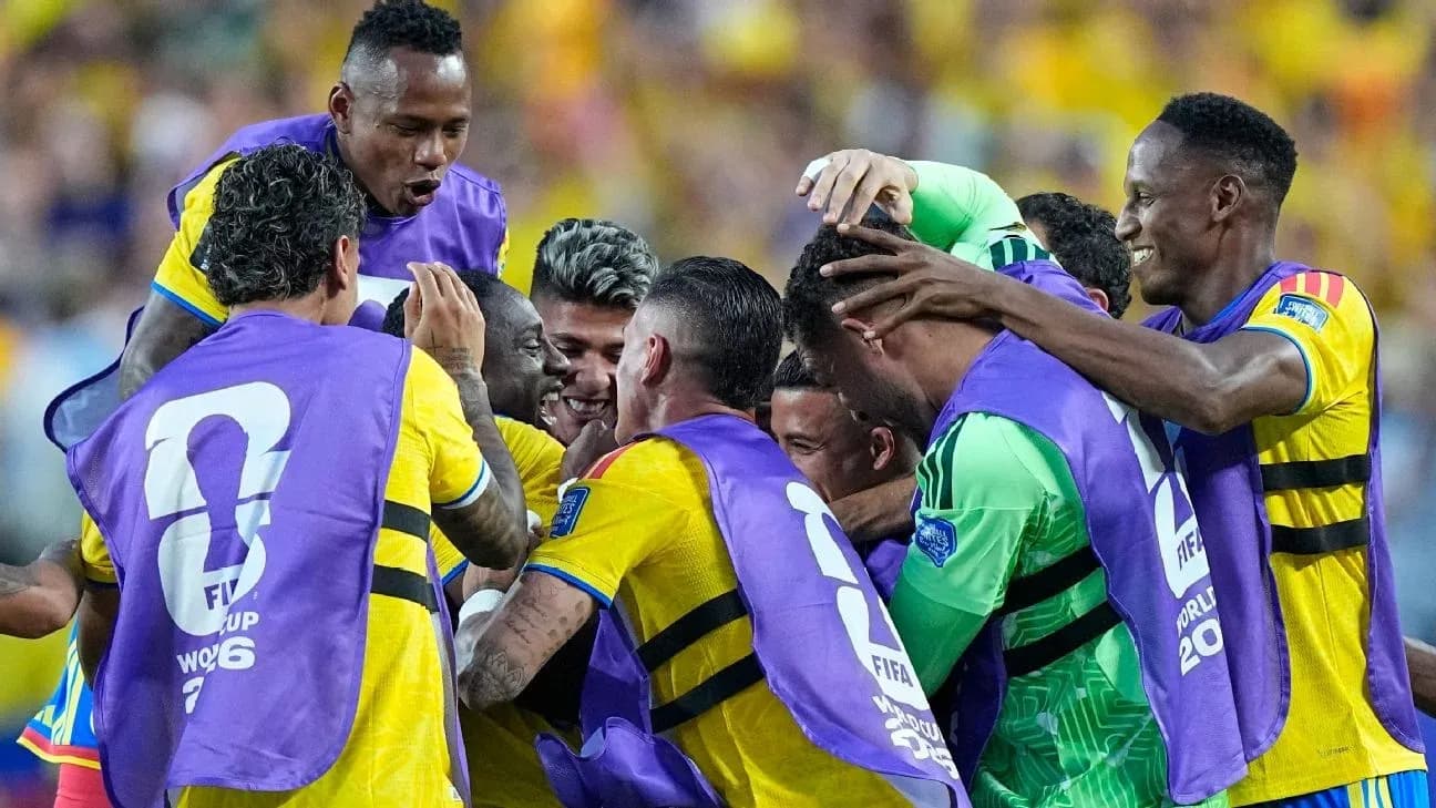 Players celebrating a goal during a match Players celebrating a goal during a match