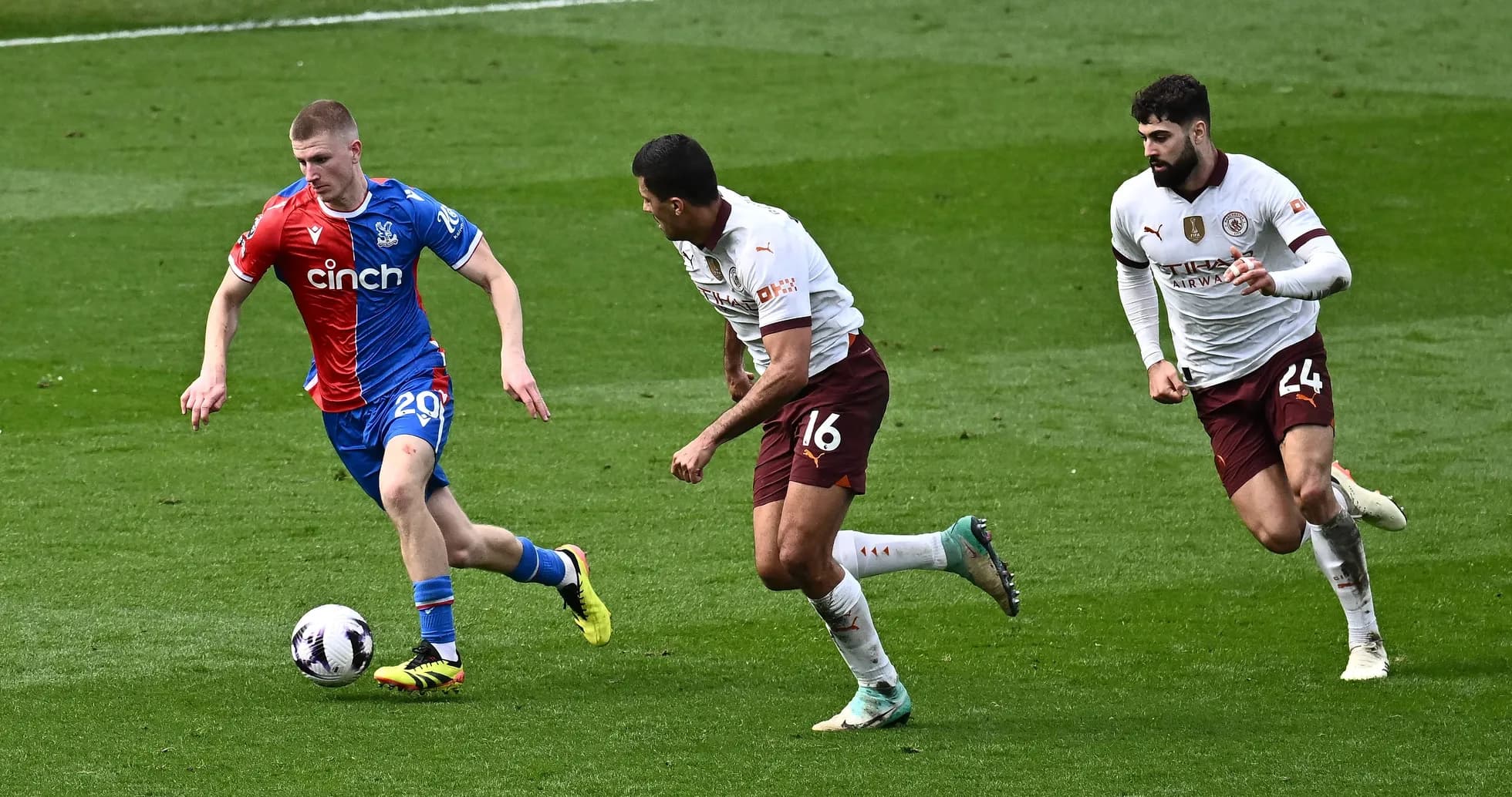 Player dribbling past two opponents during match Player dribbling past two opponents during match