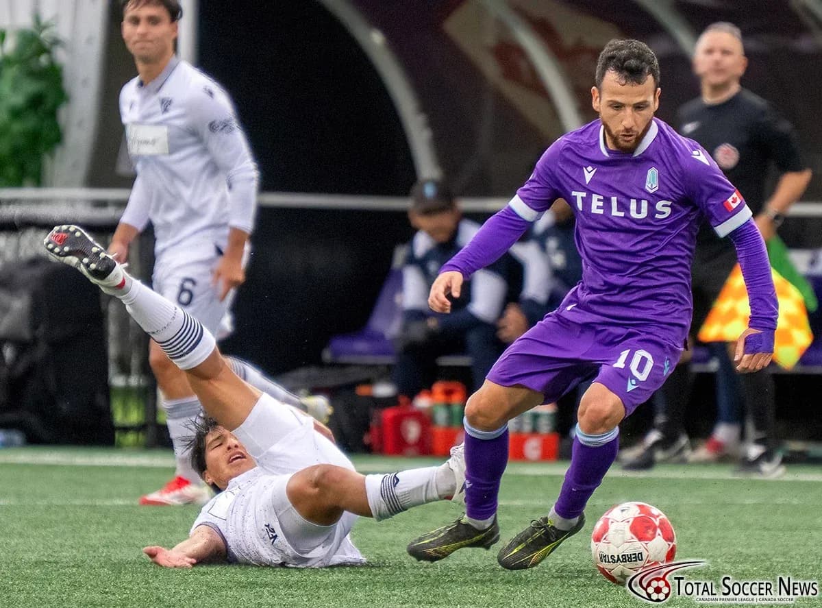 Player in purple jersey avoiding a tackle Player in purple jersey avoiding a tackle