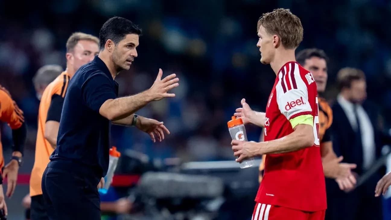 Manager discussing strategy with player during match Manager discussing strategy with player during match