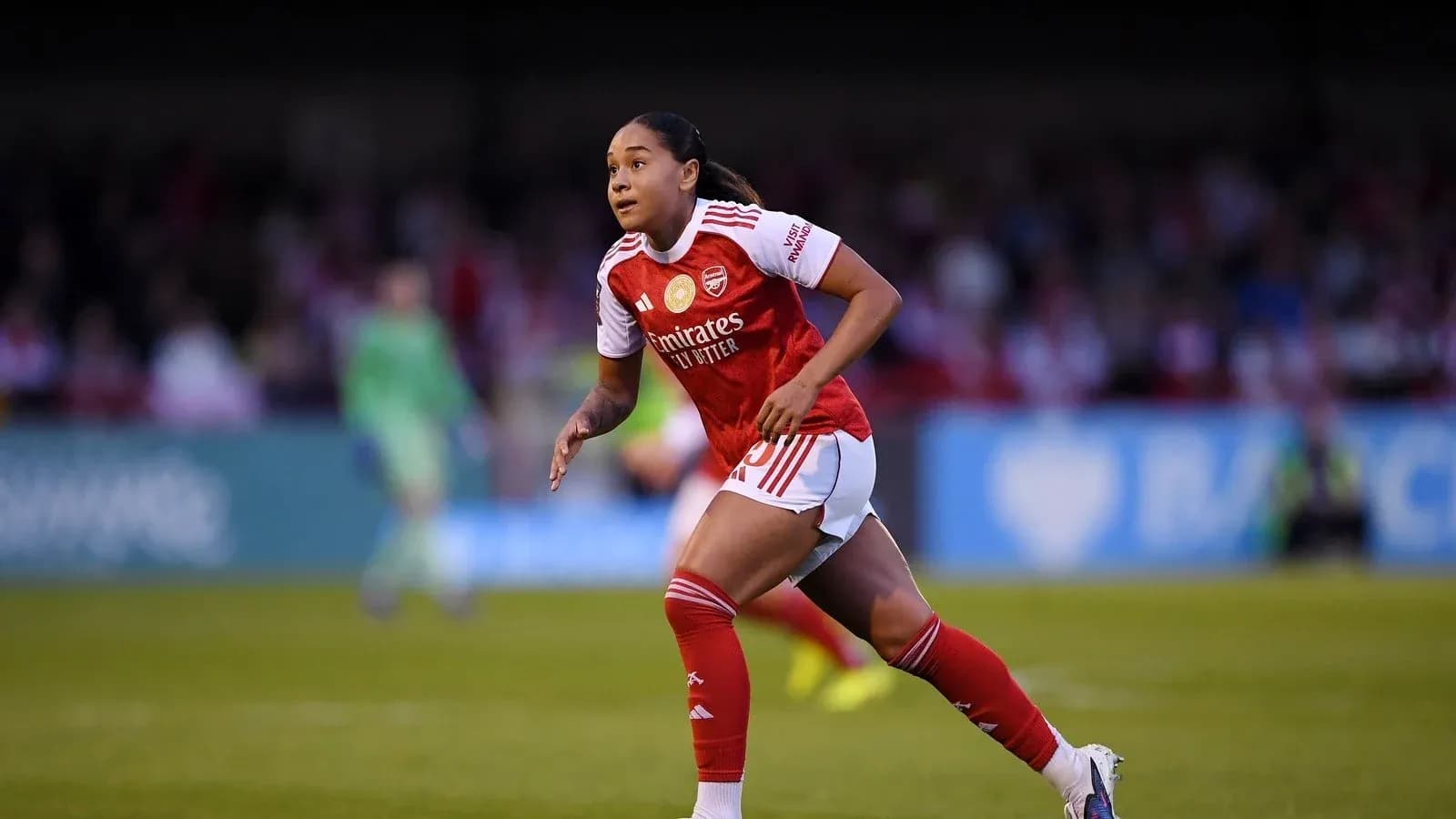 Player running on the field during a match Player running on the field during a match
