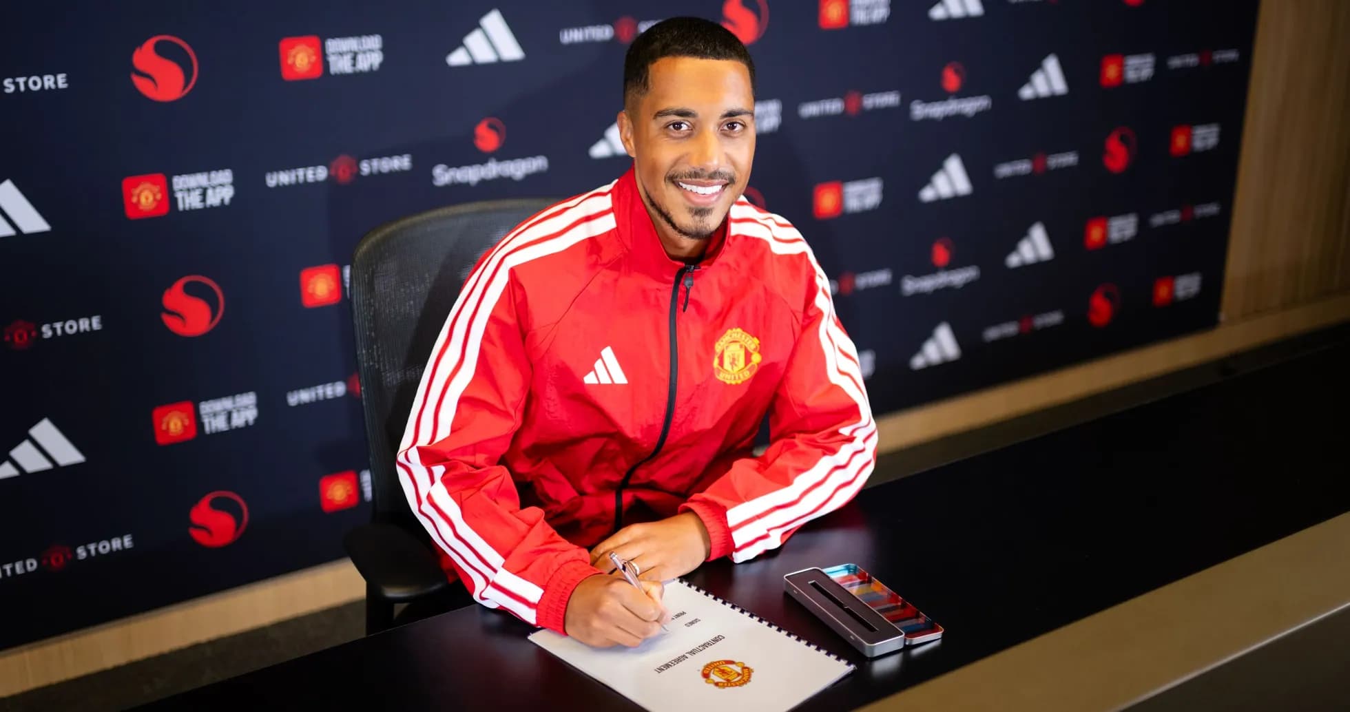 Player signing contract at Manchester United announcement event Player signing contract at Manchester United announcement event