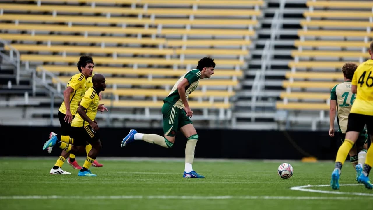 Connecticut FC player running with the ball Connecticut FC player running with the ball